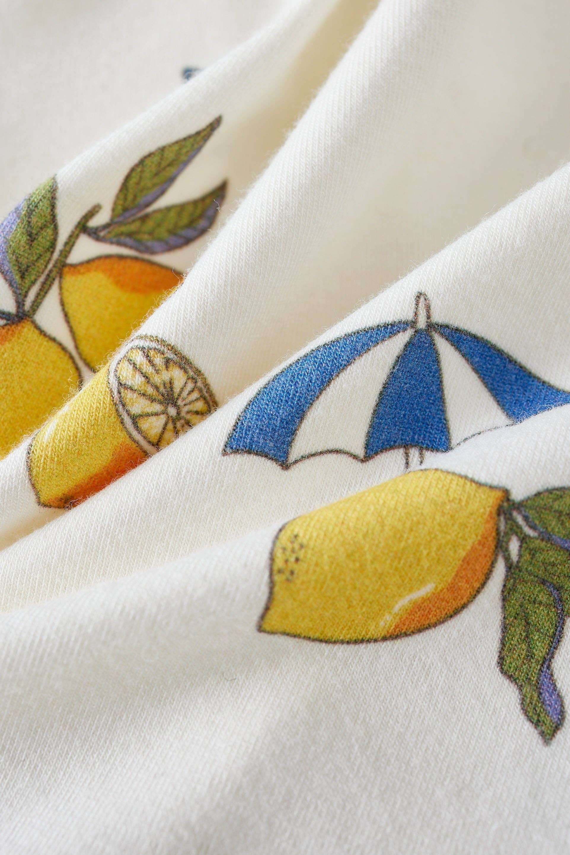 close up of the lemon print baby apparel