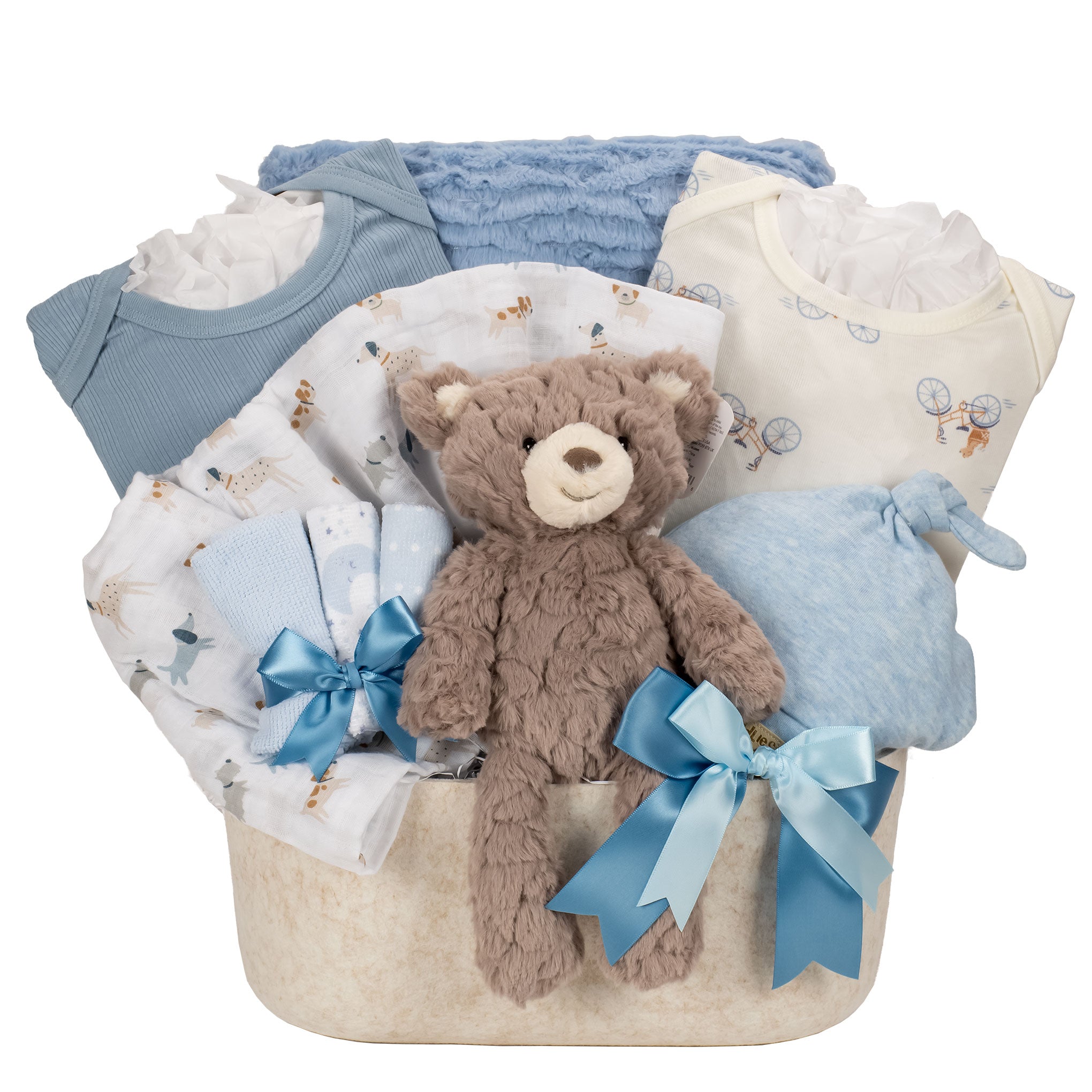 Baby gift basket with teddy bear, clothes, and blankets on a white background