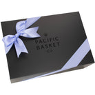 Pacific Basket Company black paperboard gift box with a lilac satin ribbon 