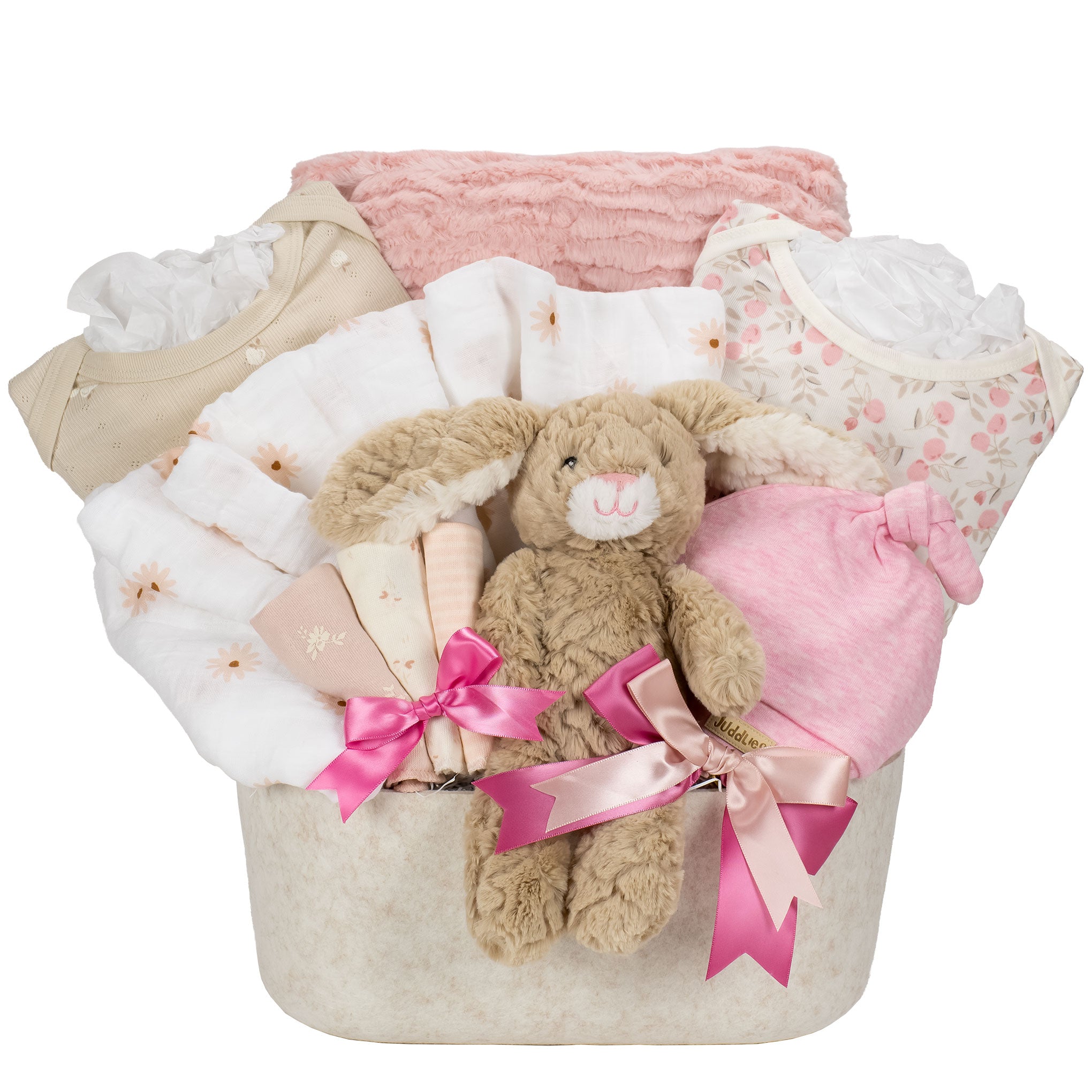 Baby gift basket with plush toy, clothes, and blankets on a white background