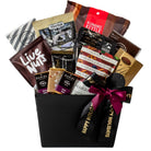 Assorted snack packets in a gift basket with a 'Happy Holidays' ribbon on a white background