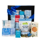 Gourmet gift box with snack mix, popcorn, chocolates, cookies tea and bath bomb.