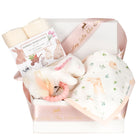 Baby gift box set with bamboo washcloths, a teether, and a bandana bib in a decorative box.