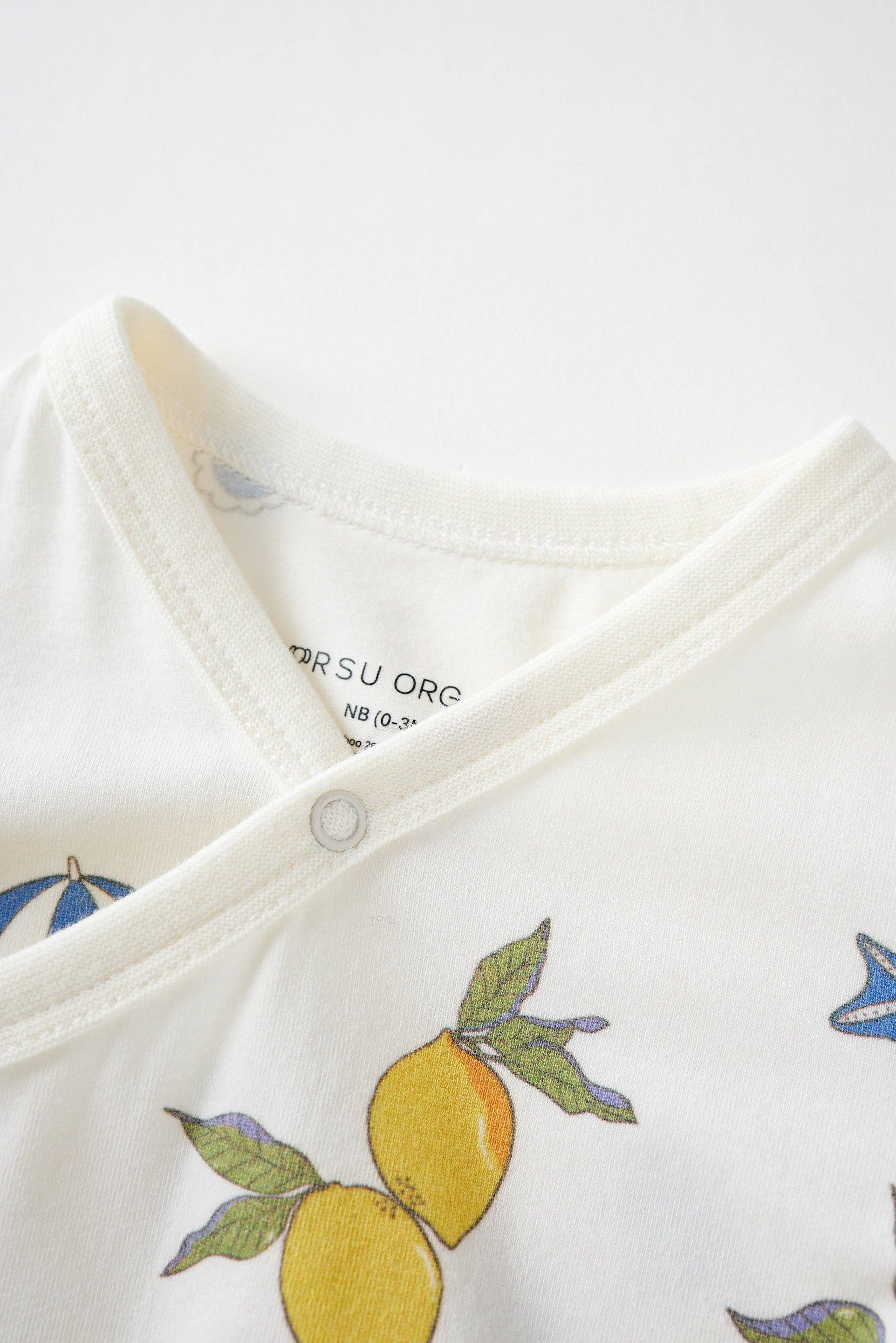 Close-up of a baby organic lemon kimono