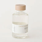 Bottle of lemon lavender bubble bath with a wooden cap on a white background