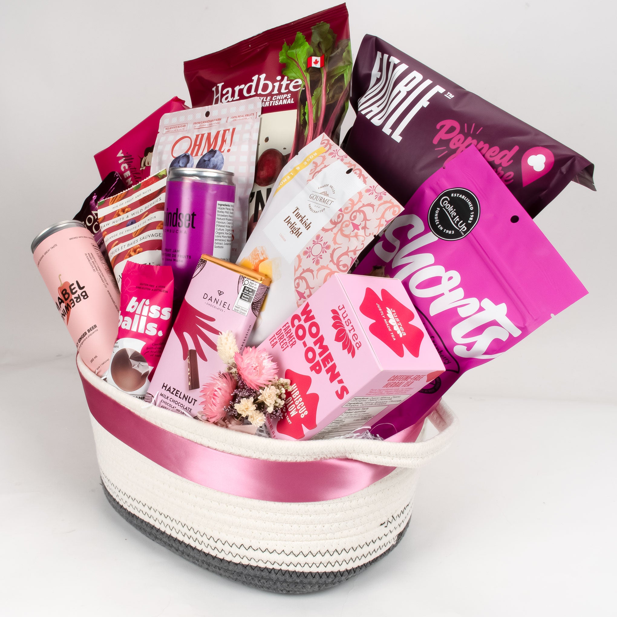 An overhead view of the Summer Soirée pink-themed gift box, showcasing the hibiscus tea and fuchsia-toned treats—ideal for Vancouver gift delivery and national shipping