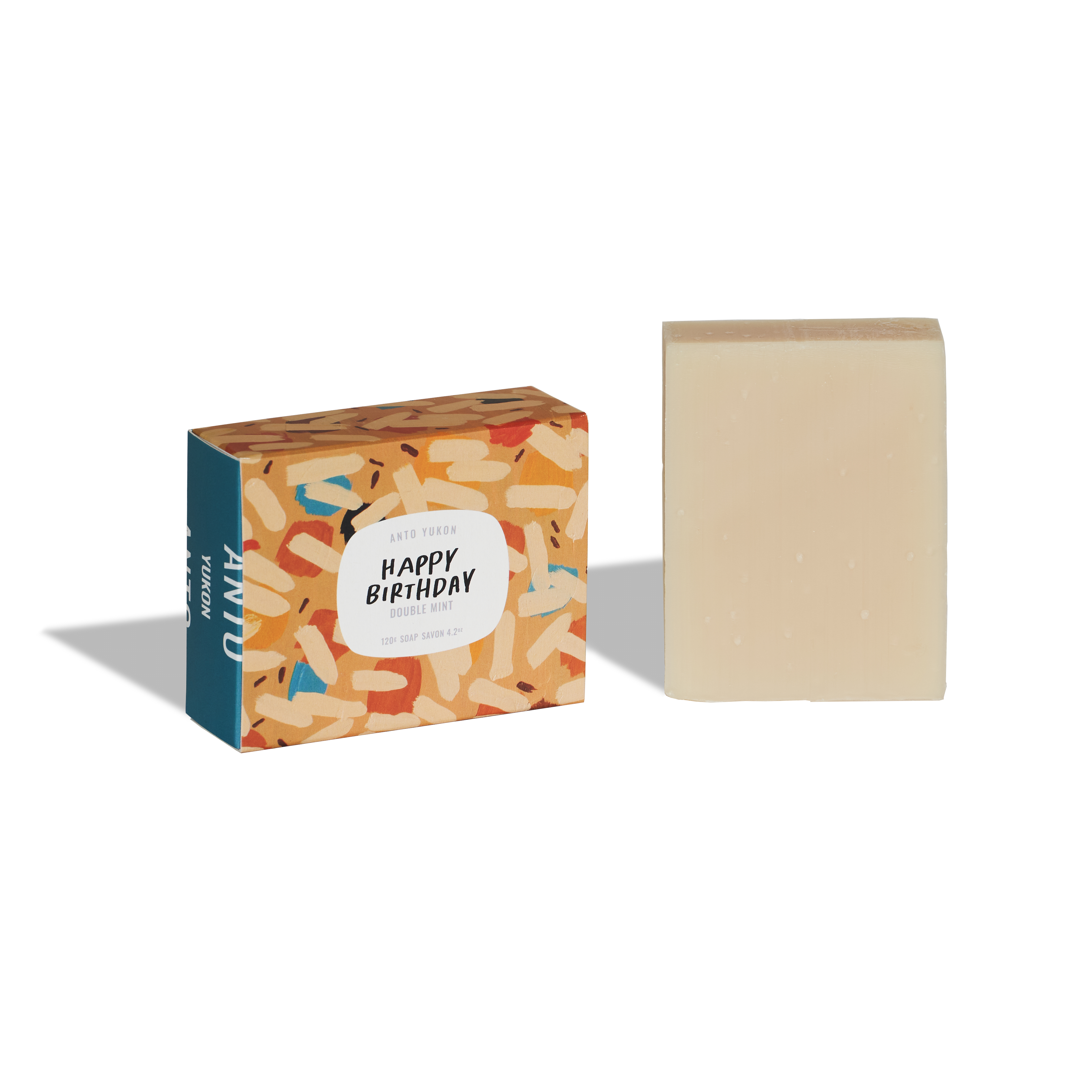 Bar of soap with a colorful packaging box labeled 'Happy Birthday' on a white background